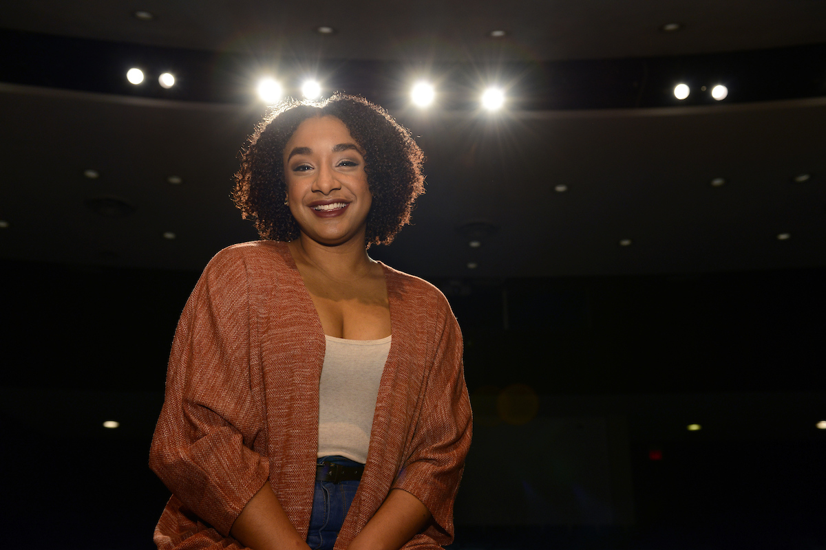 Student Testimonial: Rider University A picture of the featured student sitting on a stage.